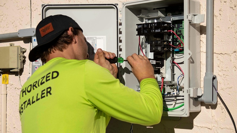 Field service technician using a digital tablet to confirm a completed repair work order.