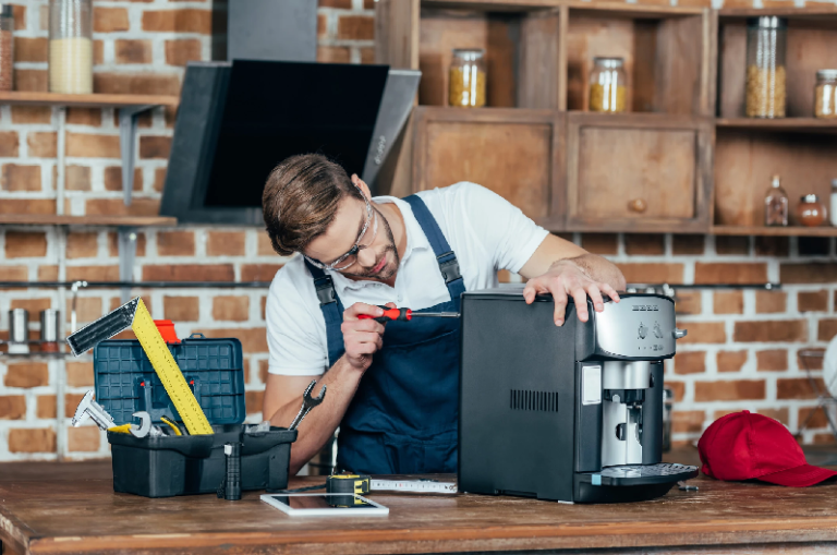 Technician repairing a commercial coffee machine not covered by a distributor service contract