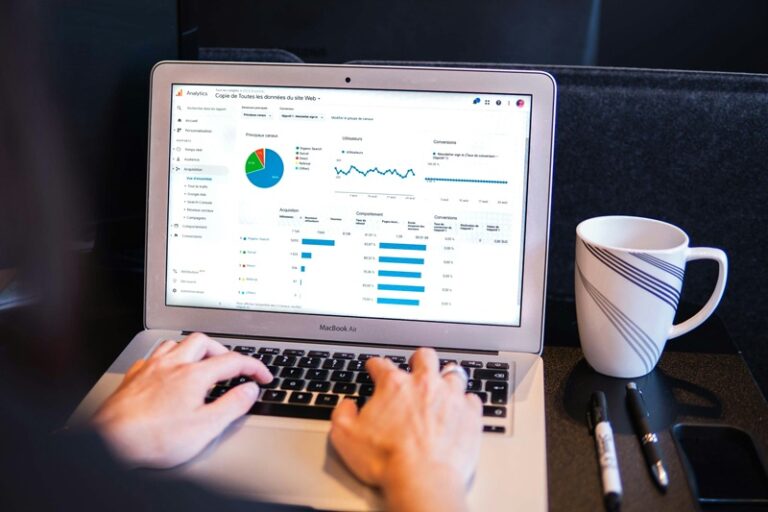 Facility manager evaluating CMMS software options on a laptop