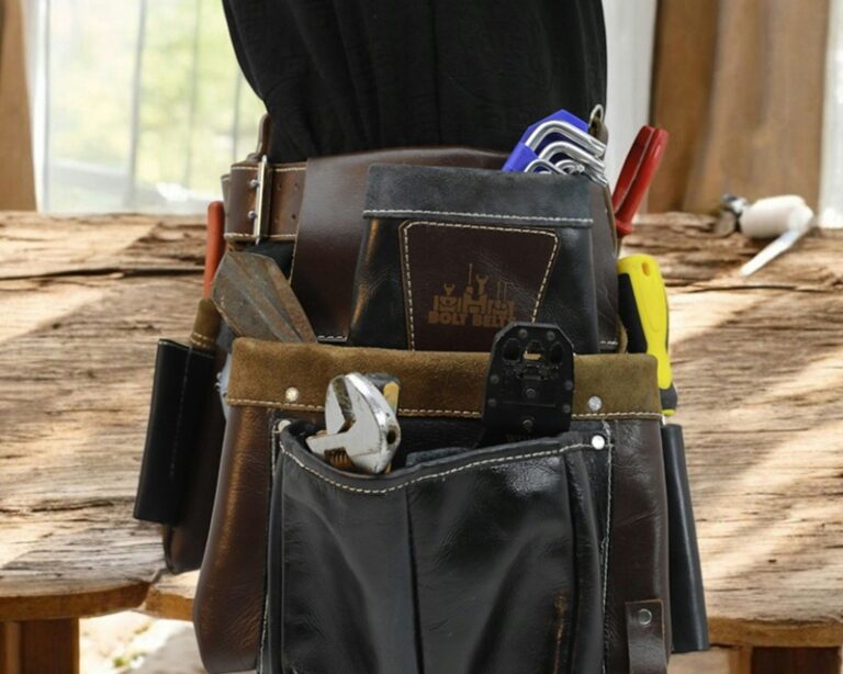 Multi-trade maintenance toolkit showing electrical, plumbing, and carpentry tools used on a single facility service visit.